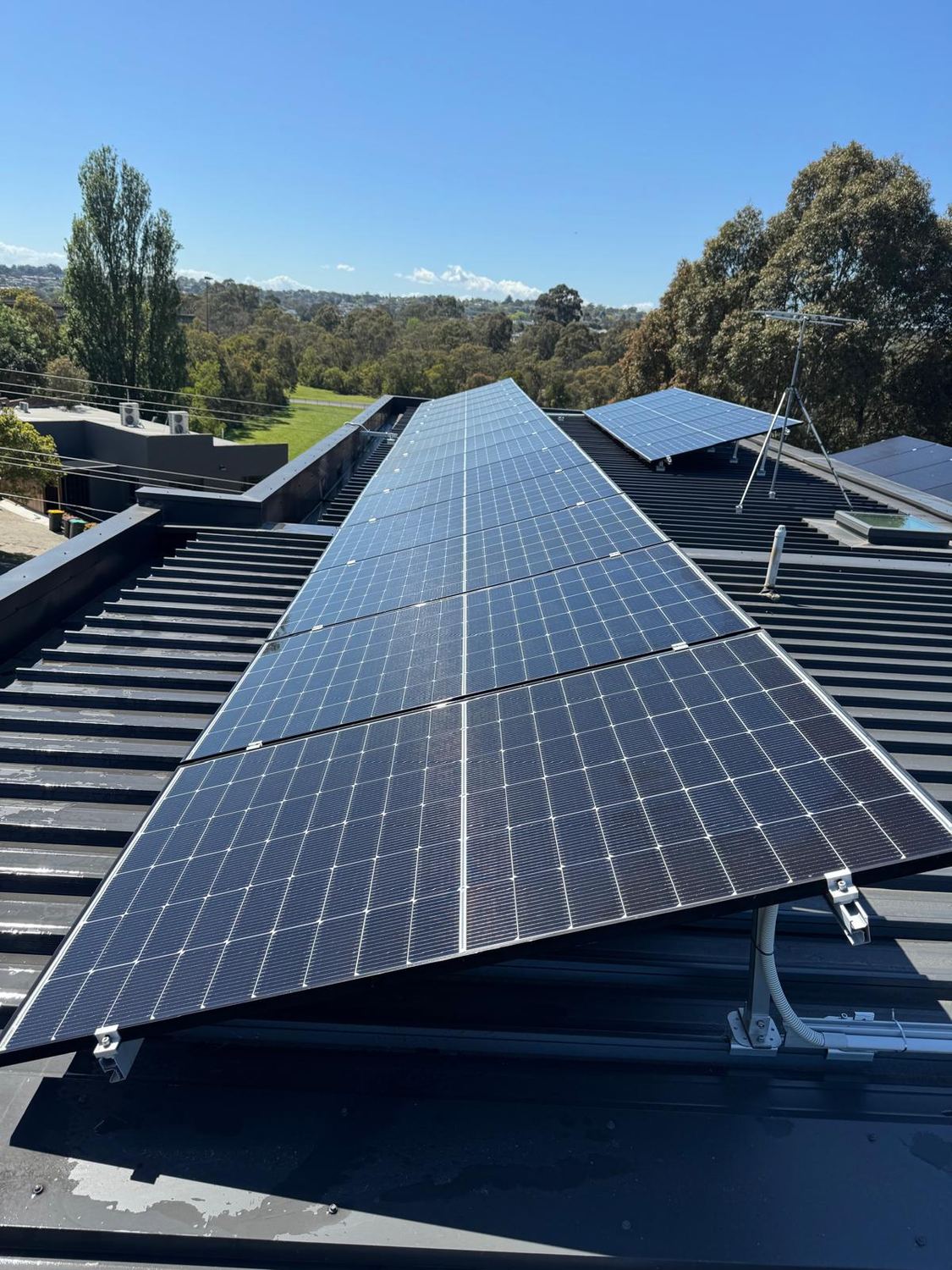 PrimePane solar panel cleaning on a roof